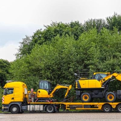 Creative blend of technology and nature with smartphone framing a bustling road through forest.